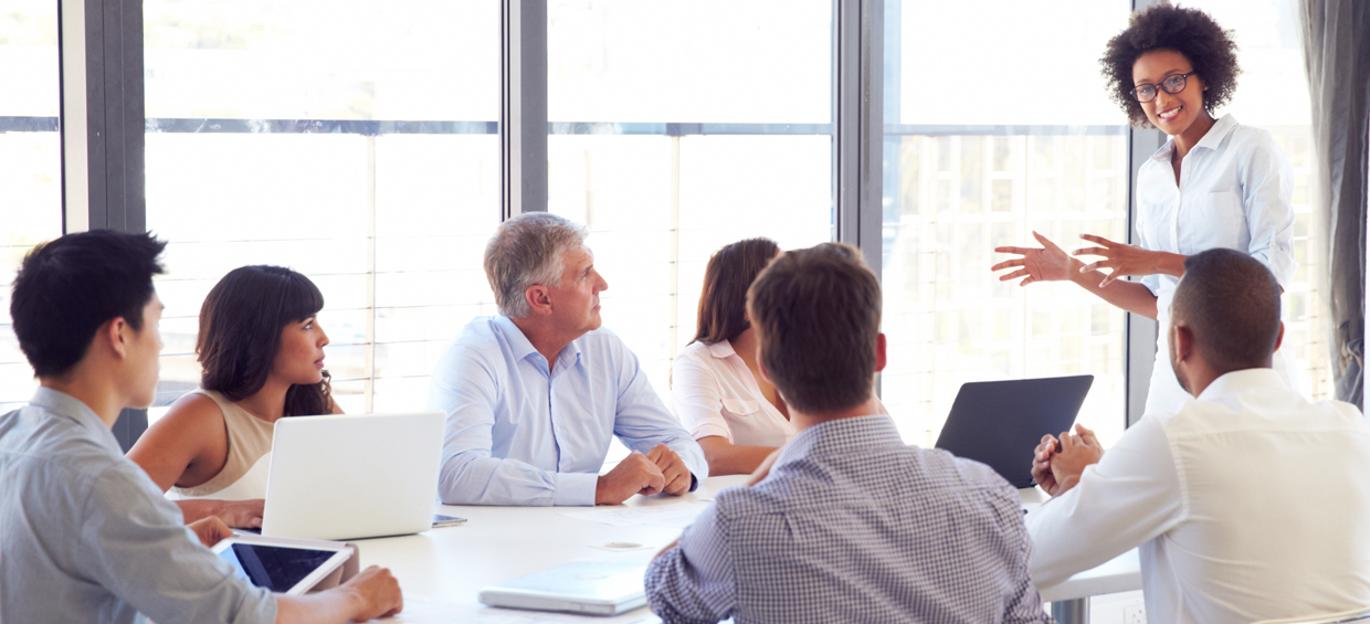 SV_Header_NonProfit_V2 Nonprofit recruiters at board table - Sheer Velocity nonprofit executive search firm