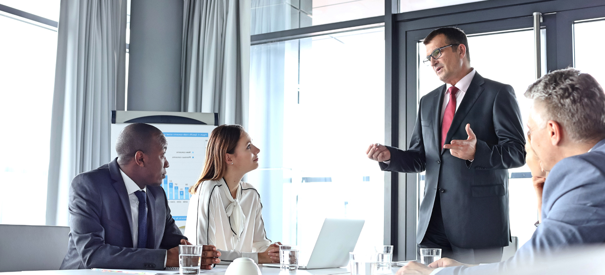 SV_Header_SearchProcess Man speaking at meeting - Sheer Velocity Executive Search Process