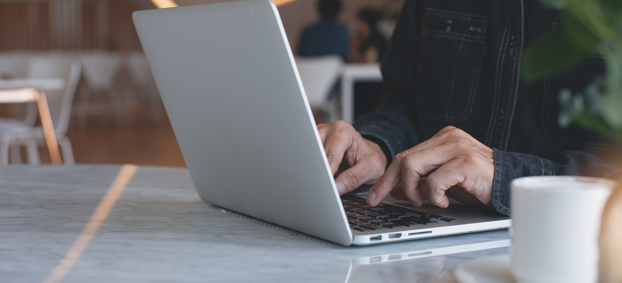 Man typing on laptop - Sheer Velocity Talent acquisition news