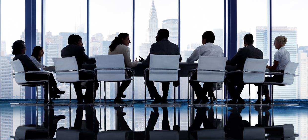 Board Members around a table - Sheer Velocity board of directors search firm